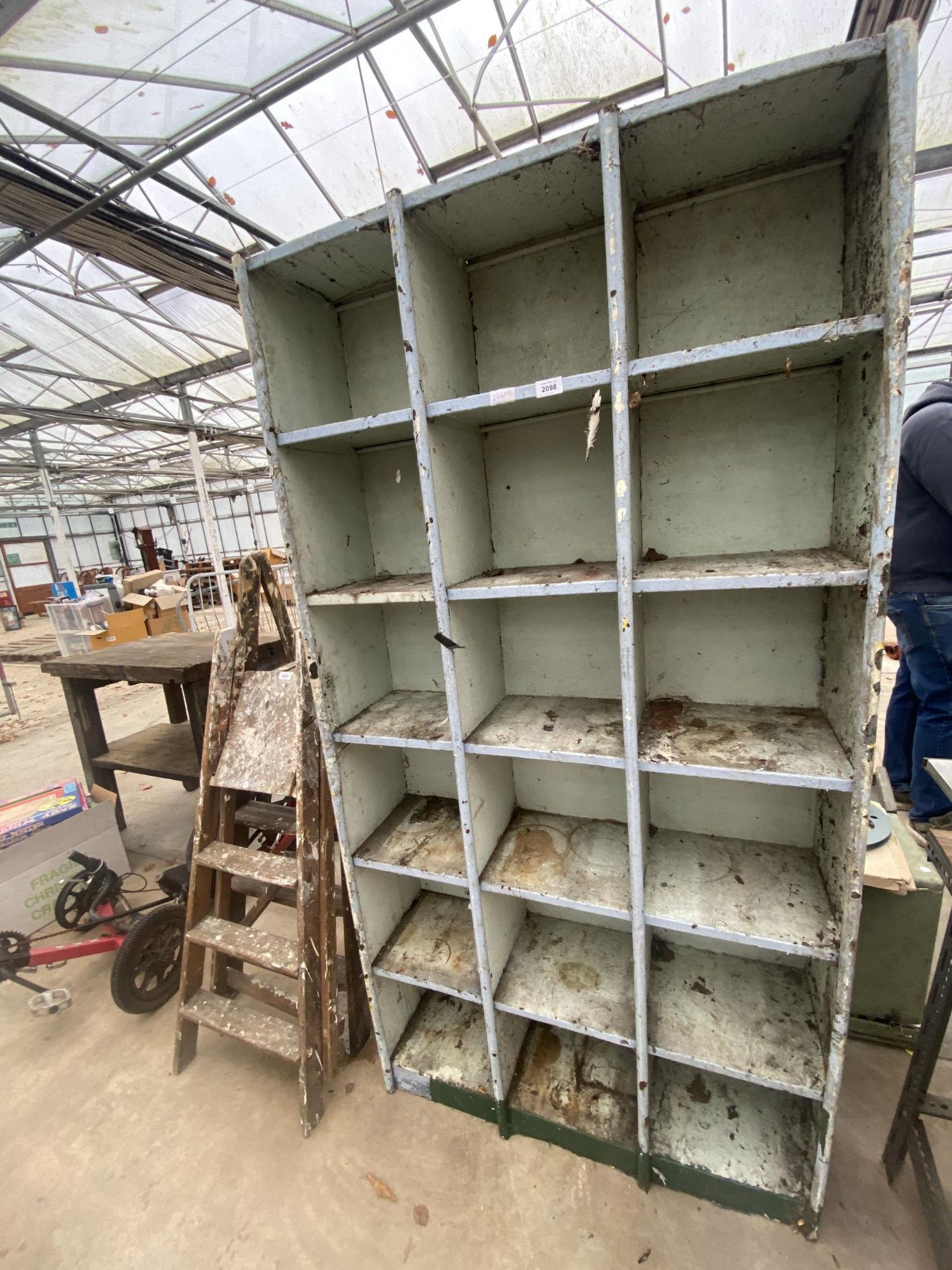 AN 18 SECTION METAL PIGEON HOLE STORAGE UNIT