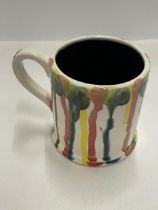 AN ANITA HARRIS HAND PAINTED AND SIGNED IN GOLD FUSION SPLASH MUG