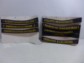 A COLLECTION OF EIGHT NAVAL CAP TALLIES AND A HMS COCHRANE BOOKLET