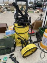 A KARCHER K4 ELECTRIC PRESSURE WASHER WITH PATIO CLEANING ATTATCHMENT