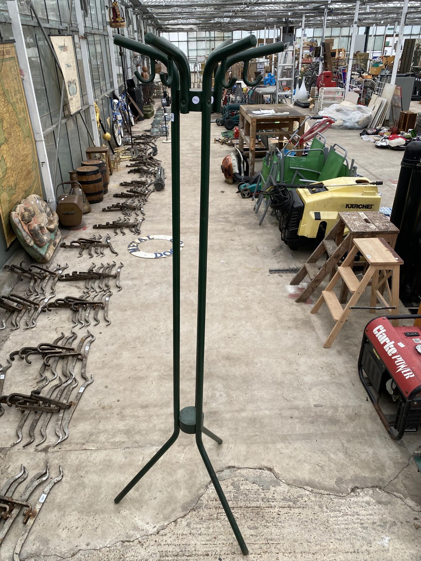 A RETRO METAL TRIPOD COAT AND HAND STAND