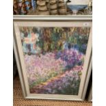 A LARGE FRAMED CLAUDE MONET PRINT 'THE ARTIST'S GARDEN AT GIVERNY', 37CM X 99CM