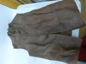 A WORLD WAR II BRITISH ARMY LEATHER JERKIN DATED DECEMBER 1942