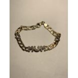 A HEAVY SILVER GILT, STAMPED 925 CURB LINK BRACELET WITH MUM AND TWO HEARTS IN CLEAR STONES