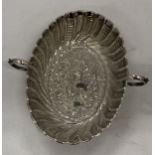 A TWIN HANDLED SILVER BOWL WITH COAT OF ARMS DESIGN