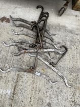 A COLLECTION OF STAINLESS STEEL BUTCHERS ABATTOIR HOOKS