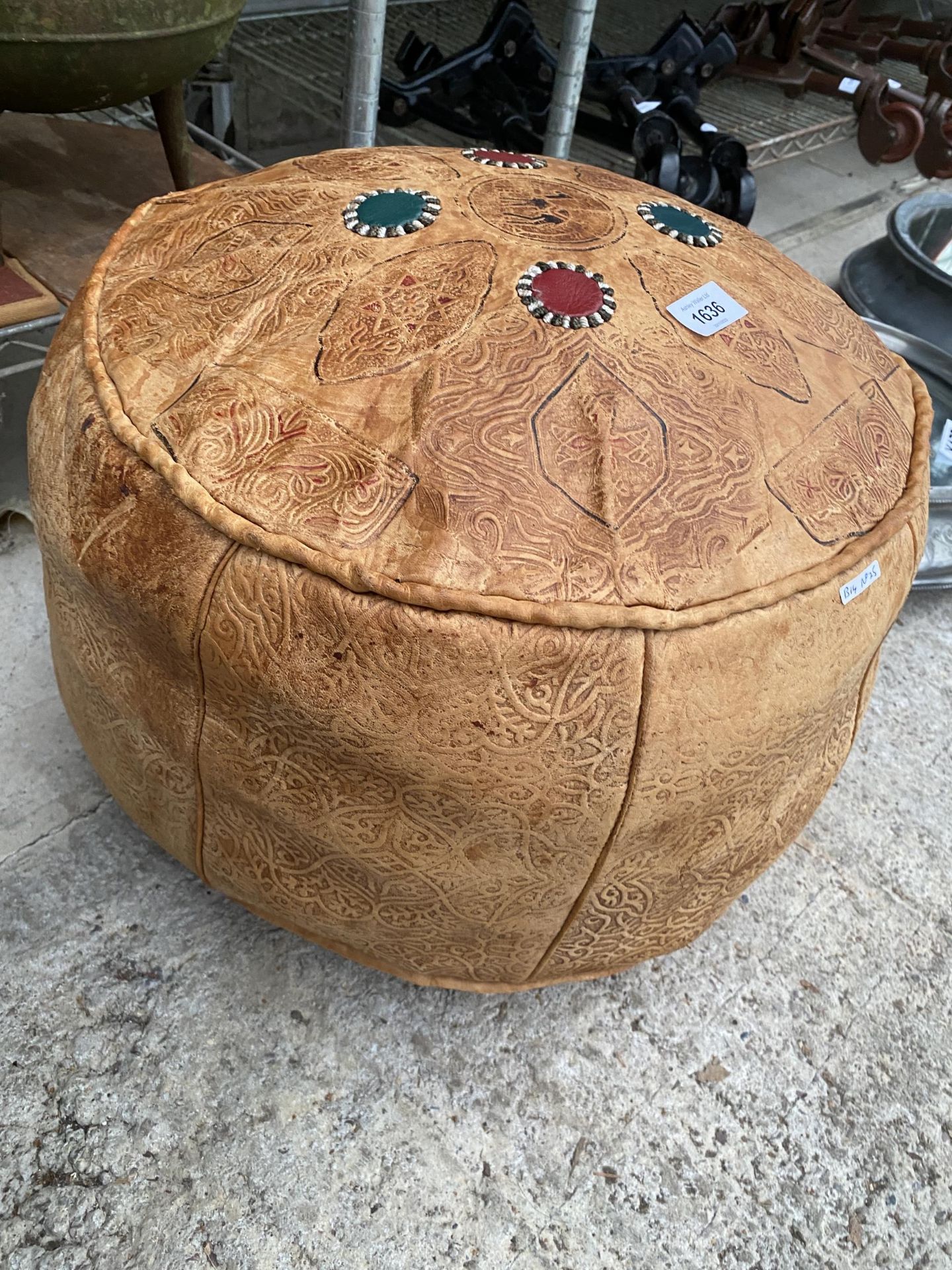 AN EGYPTIAN STYLE LEATHER POUFFE