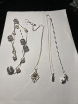 FOUR ASSORTED SILVER NECKLACES THREE WITH PENDANTS