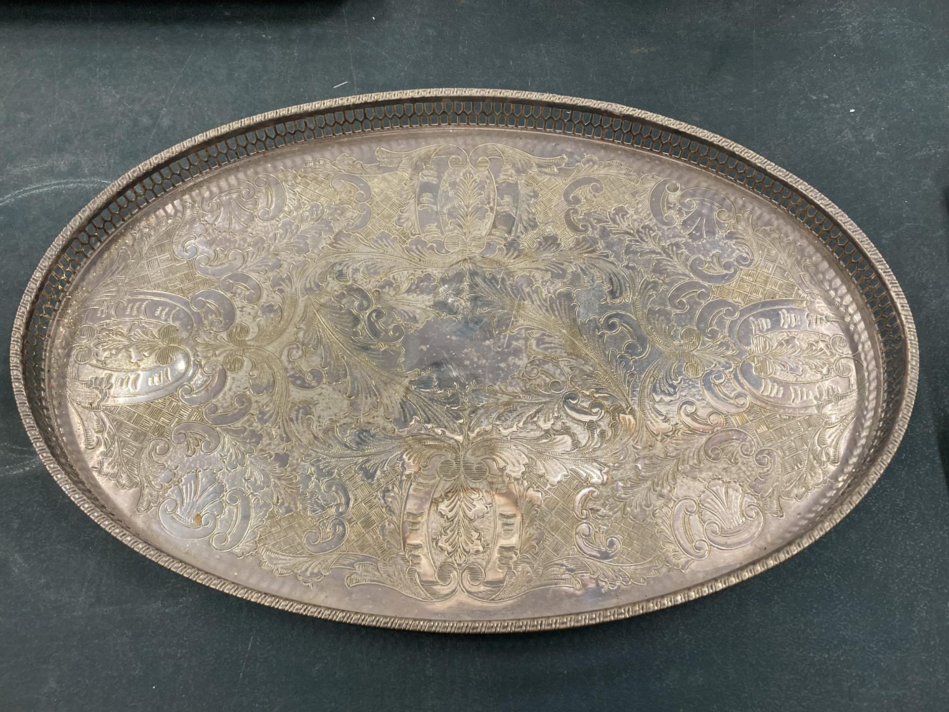 AN OVAL SILVER PLATED VINERS GALLERIED TRAY
