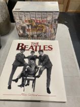 THE BEATLES ANTHOLOGY VHS TAPES IN EIGHT PARTS AND A LARGE BEATLES HARDBACK BOOK