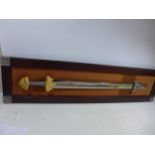 A REPLICA 'TREASURE SWORD OF THE VIKINGS' SWORD, MOUNTED ON A WOODEN FRAME, 77CM, DOUBLE EDGED
