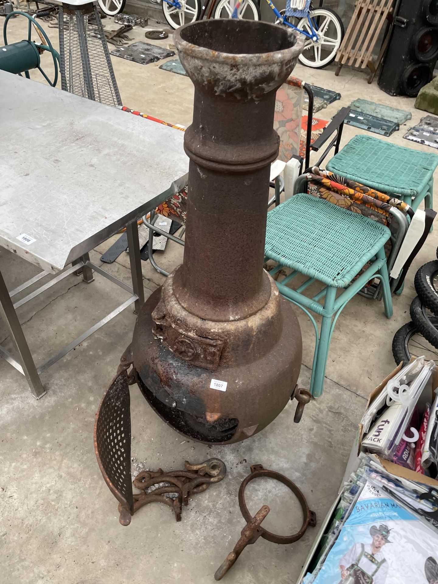 A CAST IRON GARDEN CHIMENEA ( STAND AND BASE A/F)