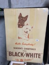 A VINTAGE STYLE TIN ADVERTISING SIGN, 'SEASONS GREETINGS FROM BLACK AND WHITE', 50CM X 70CM