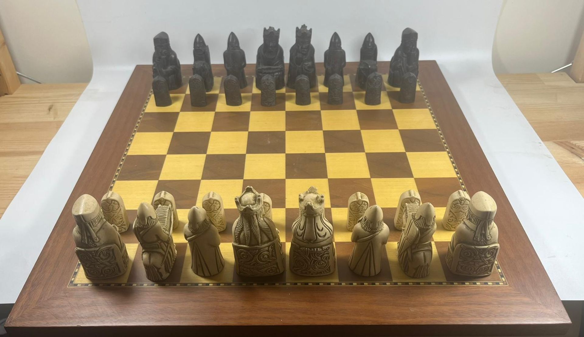 A VINTAGE LEWIS CHESSMEN CHESS SET MODELLED AS MEDIEVAL FIGURES ON AN INLAID WOODEN BOARD, KING - Image 4 of 5