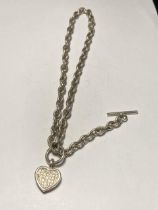 A 16" SILVER T-BAR NECK CHAIN WITH HEART PENDANT