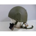 A GREEN NATO HELMET AND LINER DATED 1996