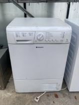 A WHITE HOTPOINT TUMBLE DRYER