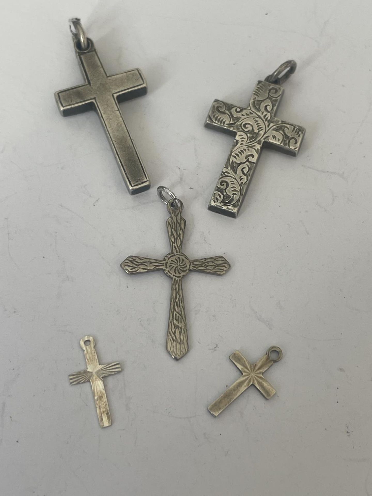 FIVE SILVER CROSSES