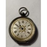 A LADIES SILVER FOB WATCH WITH DECORATIVE FACE