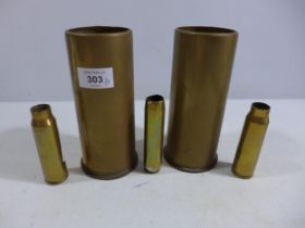 FIVE ASSORTED BRASS SHELL CASES, HEIGHTS FROM 10.5 TO 18CM