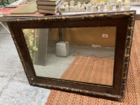 A VINTAGE LARGE HEAVY WALL MIRROR IN A WOOD AND GILT FRAME, 100CM X 75CM - FRAME IN NEED OF