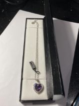 A BOXED SWAROWSKI NECKLACE WITH PURPLE HEART STONE PENDANT