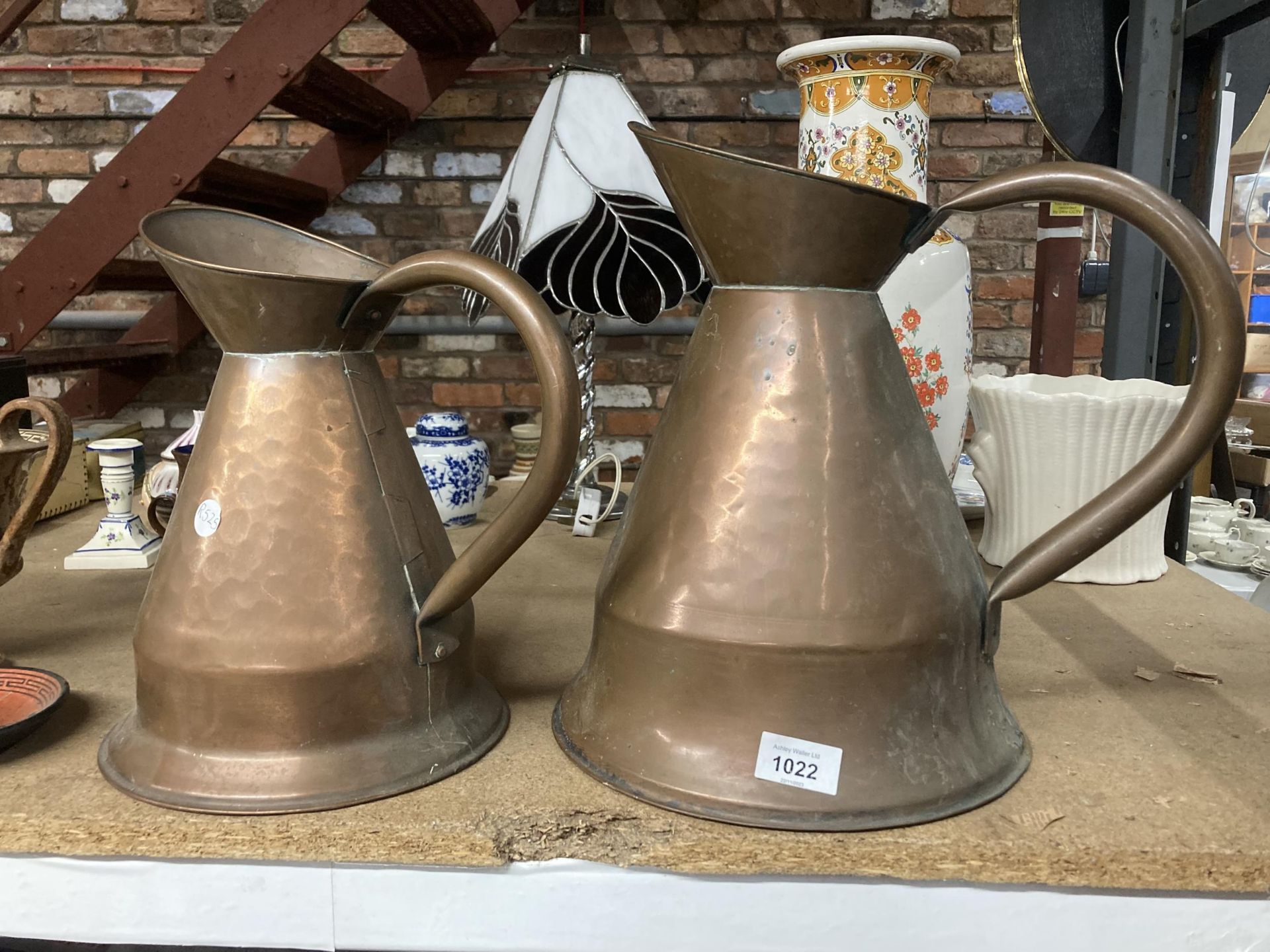 TWO LARGE HAND BEATEN COPPER JUGS