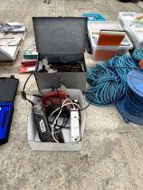 A METAL TOOL BOX WITH AN ASSORTMENT OF TOOLS AND AN ELECTRIC SANDER AND WOOD PLANE ETC