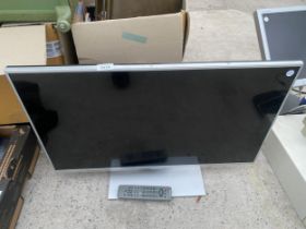 A PANASONIC 32" TELEVISION WITH REMOTE CONTROL