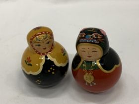 TWO RINGING 'RUSSIAN DOLLS' ON WOBBLY BASES