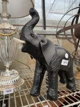 A MINIATURE LEATHER BOUND ELEPHANT FIGURE