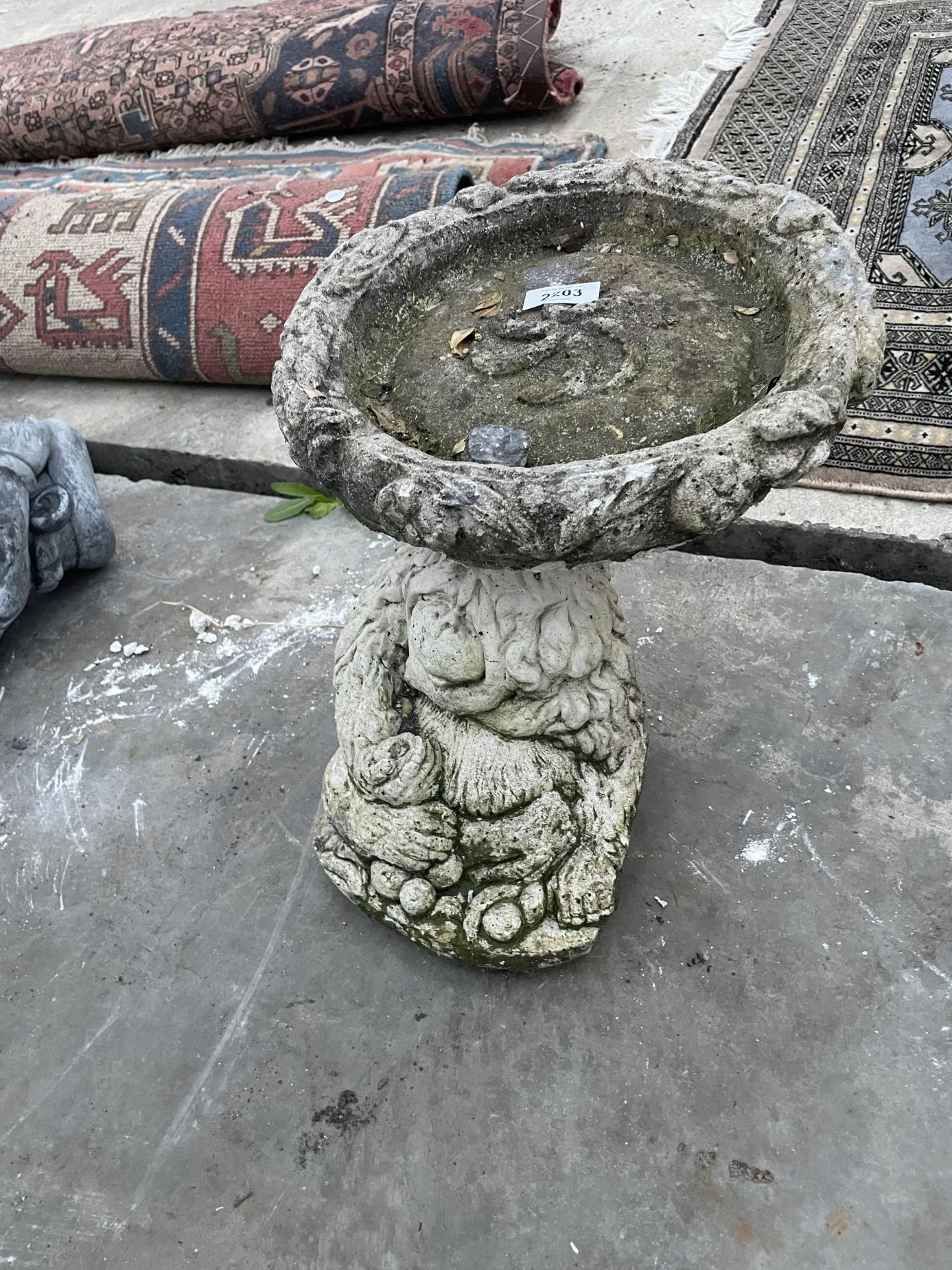 AN ORANGUTAN DESIGN CONCRETE BIRD BATH