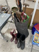 AN ASSORTMENT OF GARDEN TOOLS AND TWO PAIRS OF WELLIES