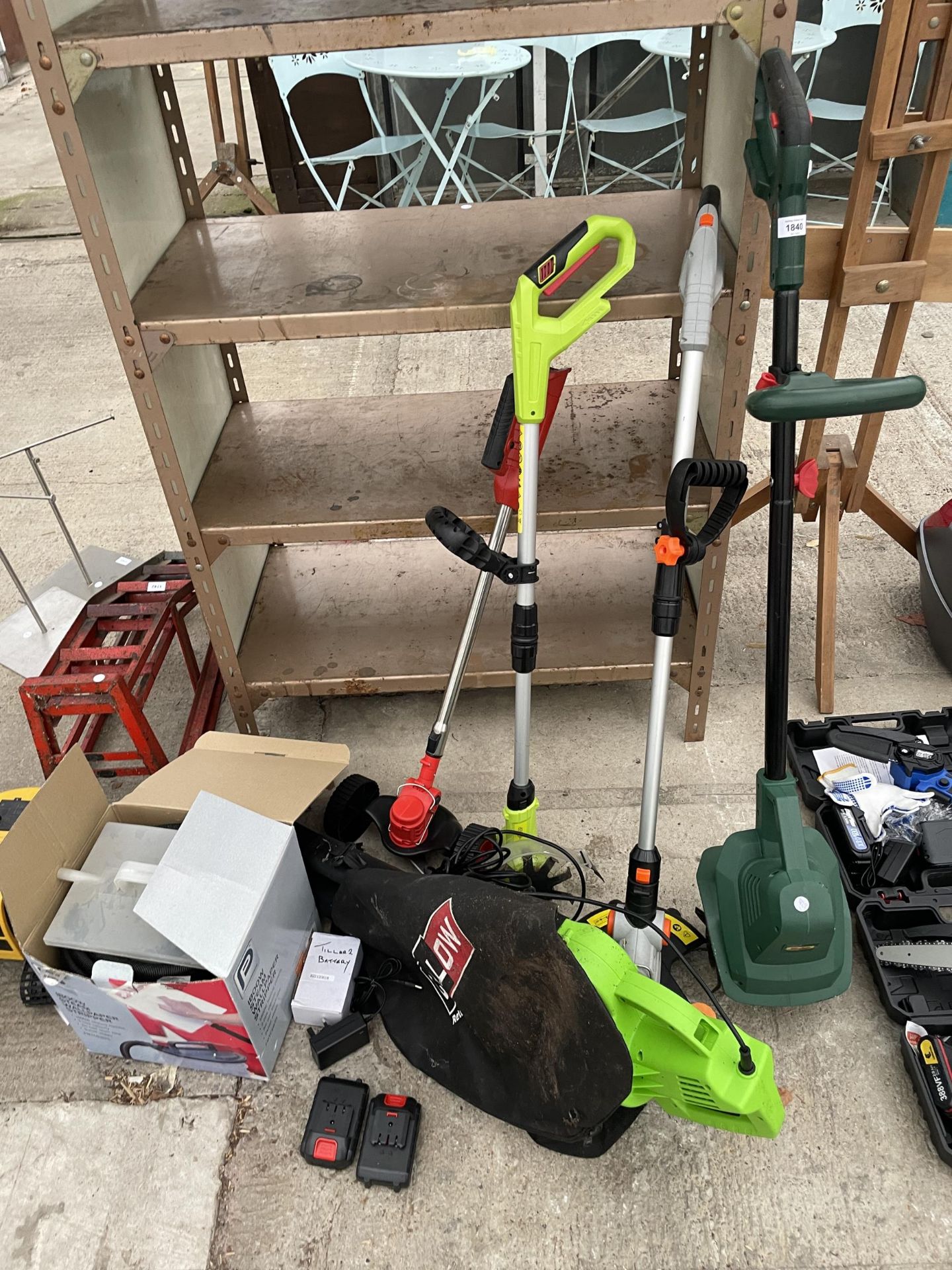 AN ASSORTMENT OF GARDEN TOOLS TO INCLUDE AN ELECTRIC TILLER, A LEAF BLOWER AND STRIMMER ETC