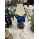 A TABLE LAMP WITH TIFFANY STYLE LEADED GLASS SHADE