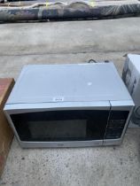 A SILVER LOGIK MICROWAVE OVEN