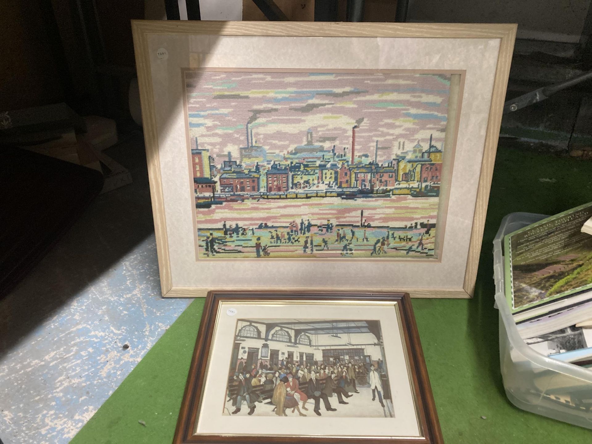 A LOWRY STYLE TAPESTRY FRAMED PICTURE AND FURTHER PRINT