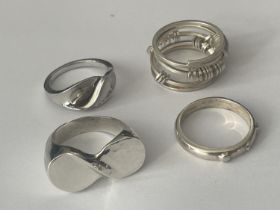 FOUR ASSORTED SILVER RINGS