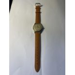 A VINTAGE AVIA OLYMPIC 15 JEWELS INCABLOC SHOCK PROTECTED WRIST WATCH WITH NEW TAN LEATHER STRAP