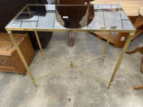 A MODERN METALWARE GOLD COLOURED CONSOLE TABLE ON FLUTED LEGS WITH INSET SMOKED GLASS TOP, 33 X 16"