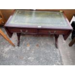 A LOW MAHOGANY SOFA TABLE WITH INSET LEATHER TOP WITH LYRE ENDS