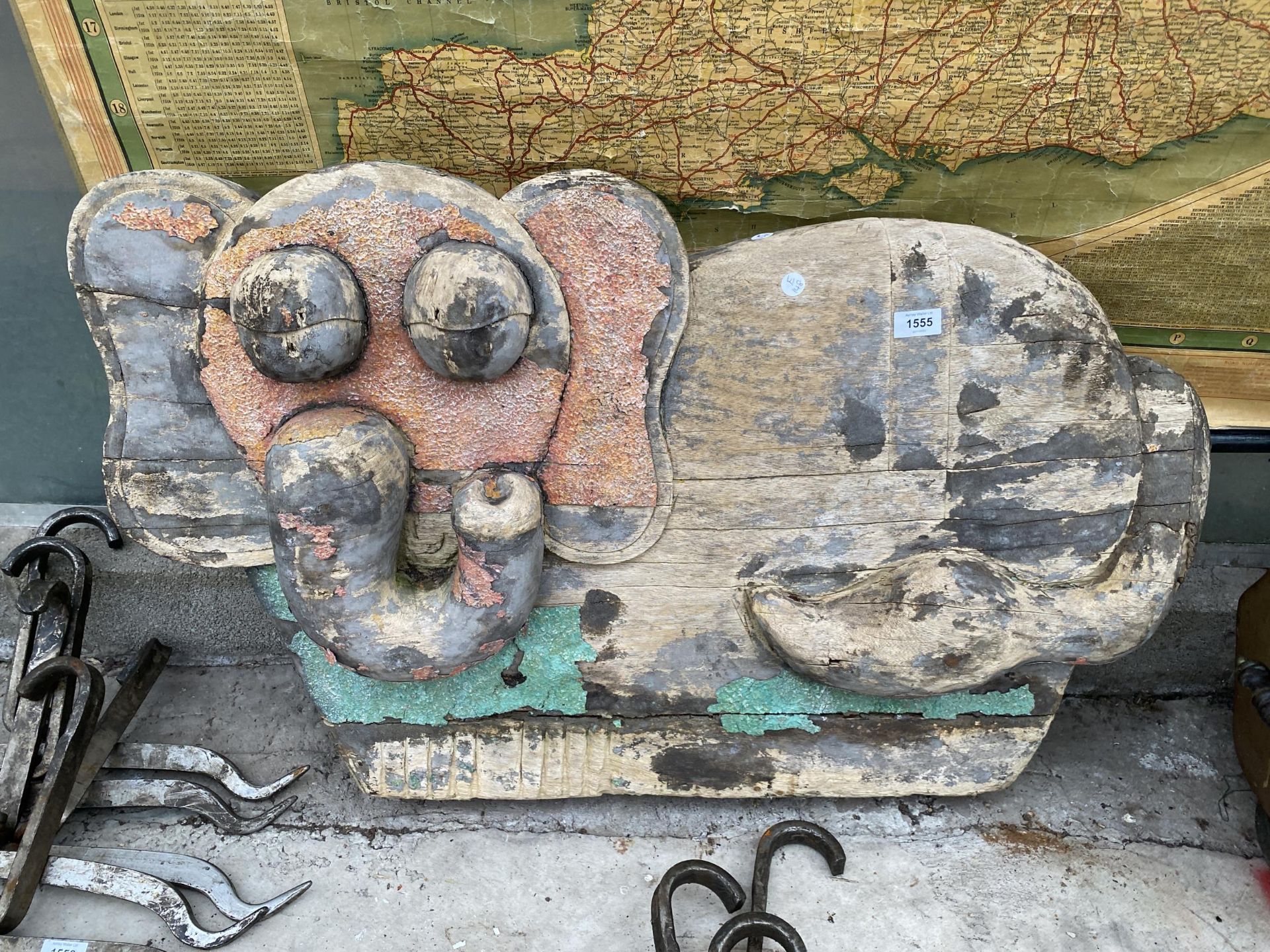 A VINTAGE WOODEN CARVED ELEPHANT WALL SIGN