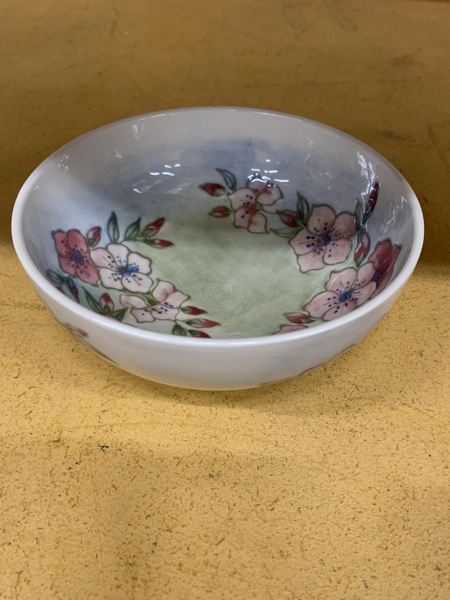 A MOORCROFT 'SPRING BLOSSOM' PATTERN BOWL DESIGNED BY SALLY TUFFIN