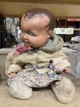 A VINTAGE PAPIER MACHE HEADED DOLL