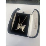 A BOXED SILVER BUTTERFLY NECKLACE