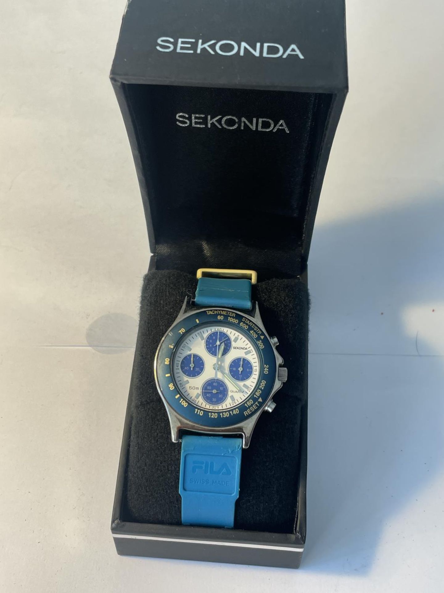 A SEKONDA WATCH WITH FILA STRAP IN A PRESENTATION BOX SEEN WORKING BUT NO WARRANTY