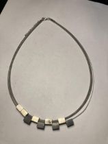 A MARKED 925 SILVER ABSTACT DESIGN NECKLACE