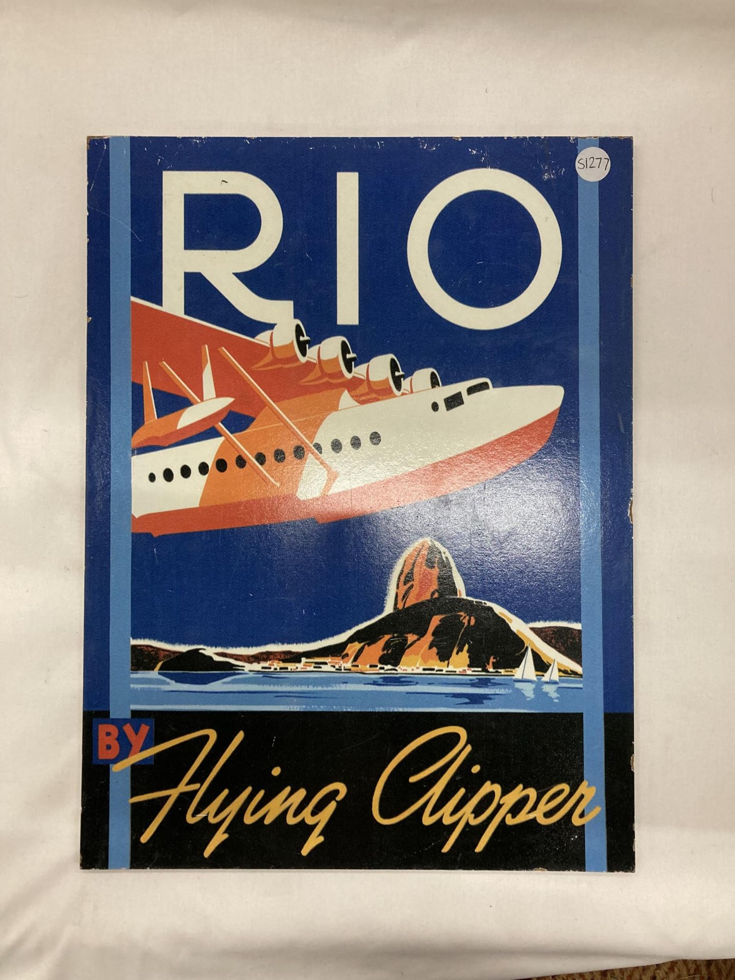 A 'RIO FLYING CLIPPER' SIGN, 30CM X 40CM