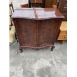 A MODERN MAHOGANY AND WALNUT SERPENTINE FRONTED 'NOVALINEA' TV/VIDEO CABINET, 37.5" WIDE