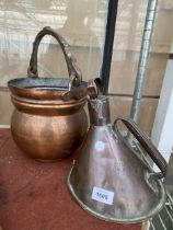 A HANDMADE HAMMERED COPPER BUCKET AND A VINTAGE COPPER OIL CAN